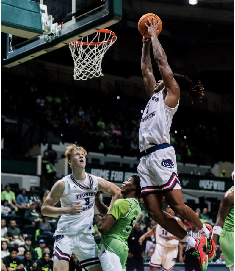 FAU guard Kaleb Glenn dunking the ball against USF on March 1. The Owls defeated the Bulls for the second time this season 69-63.